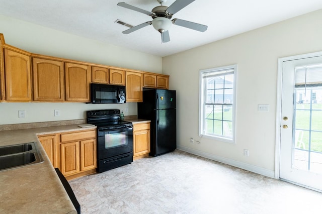 1600 Wards Ferry Rd Unit 204, Lynchburg, VA 24502 - kitchen featuring black appliances, a sink, ceiling fan, light countertops, and baseboards