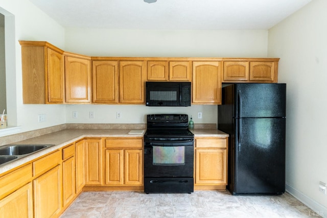1600 Wards Ferry Rd Unit 204, Lynchburg, VA 24502 - kitchen featuring black appliances, light countertops, and a sink