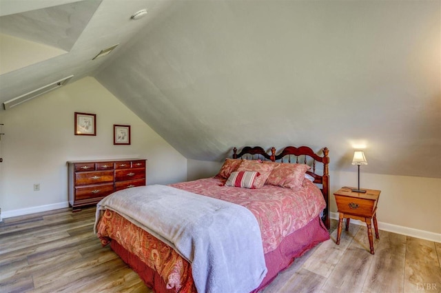 450 Holyfield Ln, Moneta, VA 24121 - bedroom featuring wood finished floors and lofted ceiling