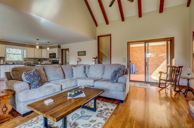 450 Holyfield Ln, Moneta, VA 24121 - living area with light wood-style flooring, a ceiling fan, beam ceiling, and high vaulted ceiling