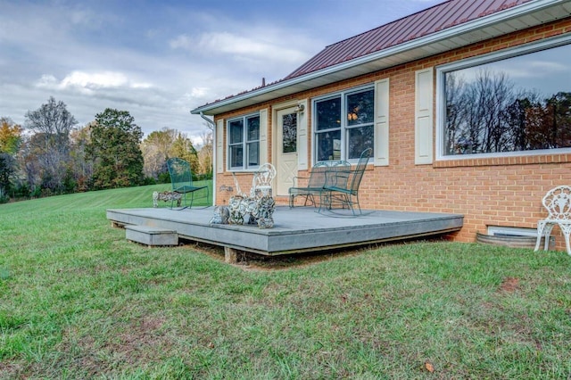 450 Holyfield Ln, Moneta, VA 24121 - exterior space featuring brick siding, a standing seam roof, a metal roof, a yard, and a wooden deck