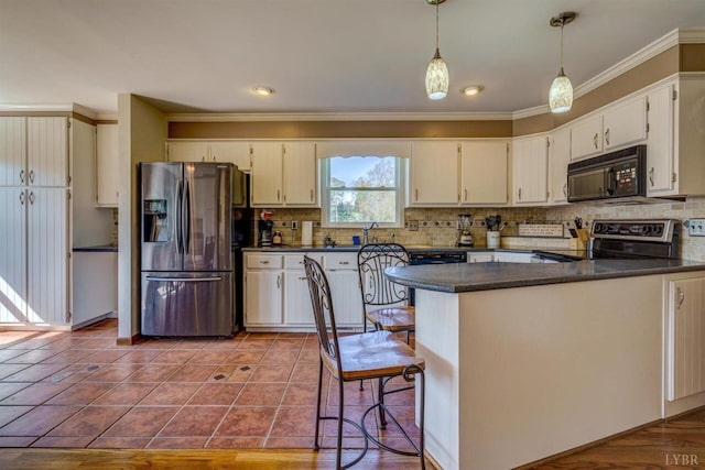 450 Holyfield Ln, Moneta, VA 24121 - kitchen with stainless steel fridge, stove, black microwave, dark countertops, and crown molding
