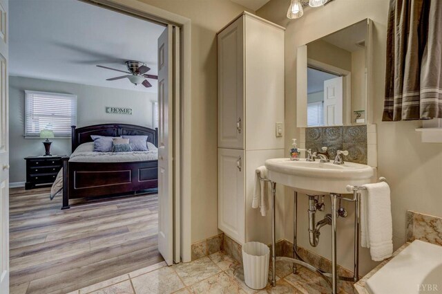 450 Holyfield Ln, Moneta, VA 24121 - bathroom with a ceiling fan, decorative backsplash, and ensuite bath