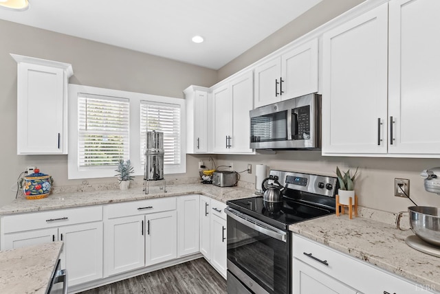 19 Cuddington Ln, Lynchburg, VA 24501 - kitchen featuring stainless steel appliances, white cabinets, recessed lighting, wood finished floors, and light stone countertops