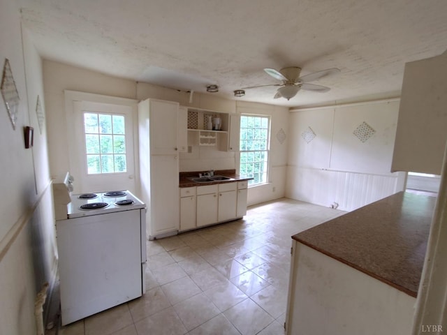 1503 Jackson St, Lynchburg, VA 24504 - kitchen featuring white electric stove, a ceiling fan, white cabinets, open shelves, and light tile patterned flooring