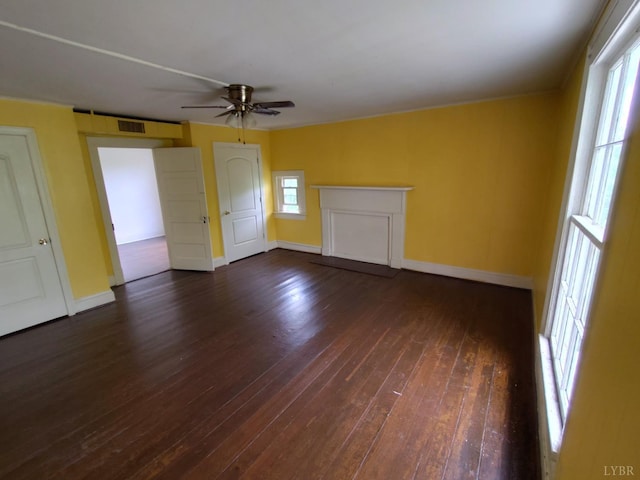 1503 Jackson St, Lynchburg, VA 24504 - unfurnished living room with dark wood finished floors, ceiling fan, and baseboards