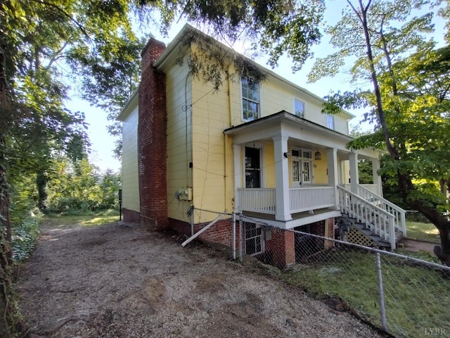 1503 Jackson St, Lynchburg, VA 24504 - view of front of house featuring covered porch, stairs, and a chimney