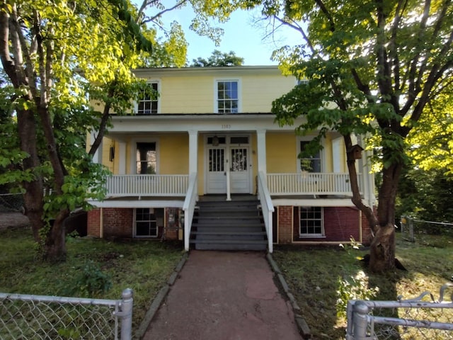 1503 Jackson St, Lynchburg, VA 24504 - view of front of home with covered porch, stairs, french doors, and brick siding