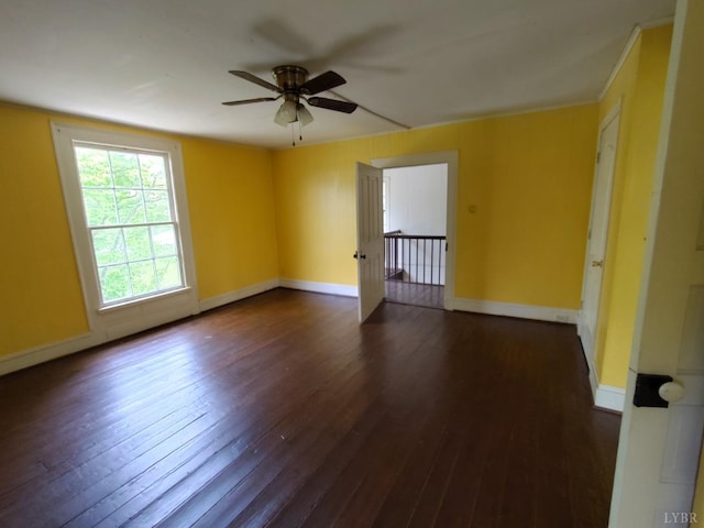 1503 Jackson St, Lynchburg, VA 24504 - spare room featuring dark wood-style floors, a ceiling fan, and baseboards