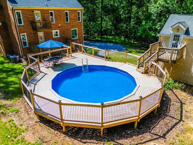 134 Woodmont Ln, Forest, VA 24551 - swimming pool with a wooden deck, central AC, and outdoor dining space