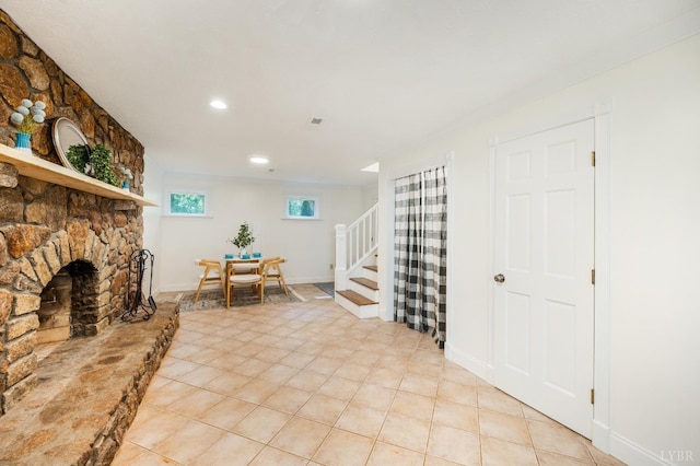 134 Woodmont Ln, Forest, VA 24551 - foyer entrance featuring a stone fireplace, light tile patterned floors, stairway, and recessed lighting