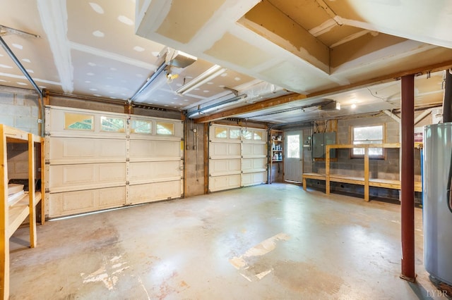 134 Woodmont Ln, Forest, VA 24551 - garage featuring concrete block wall and gas water heater