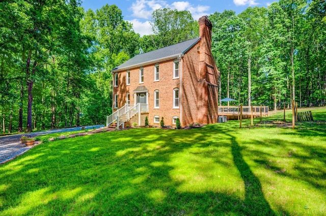 134 Woodmont Ln, Forest, VA 24551 - view of front of property with a chimney, a front yard, and brick siding