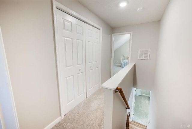 134 Woodmont Ln, Forest, VA 24551 - hallway featuring carpet floors, an upstairs landing, and baseboards
