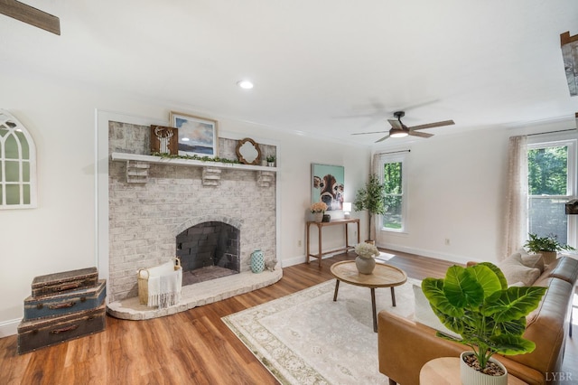 134 Woodmont Ln, Forest, VA 24551 - living room featuring wood finished floors, ceiling fan, a fireplace, baseboards, and recessed lighting