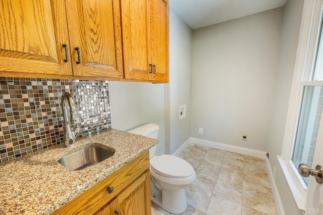 134 Woodmont Ln, Forest, VA 24551 - bathroom with decorative backsplash, toilet, baseboards, and vanity