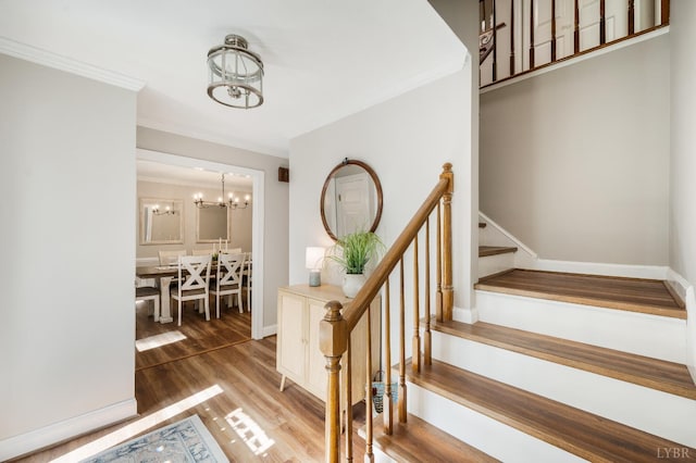134 Woodmont Ln, Forest, VA 24551 - staircase with a chandelier, wood finished floors, ornamental molding, and baseboards