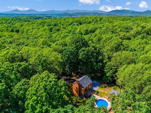 134 Woodmont Ln, Forest, VA 24551 - aerial view of a heavily wooded area, a mountainous background, and a pool
