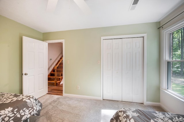 134 Woodmont Ln, Forest, VA 24551 - unfurnished bedroom with carpet flooring, a closet, baseboards, and a ceiling fan