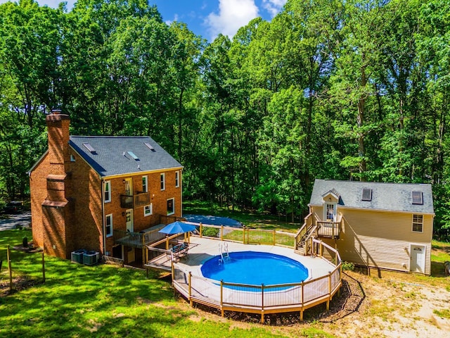134 Woodmont Ln, Forest, VA 24551 - view of swimming pool featuring a wooden deck and central air condition unit