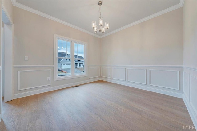 20 Elk Creel Rd, Forest, VA 24551 - empty room with a chandelier, wood finished floors, a decorative wall, crown molding, and a wainscoted wall