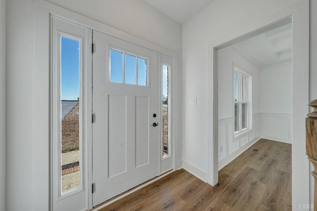1197 Elk Creek Rd, Forest, VA 24551 - foyer with wood finished floors, wainscoting, a decorative wall, and crown molding
