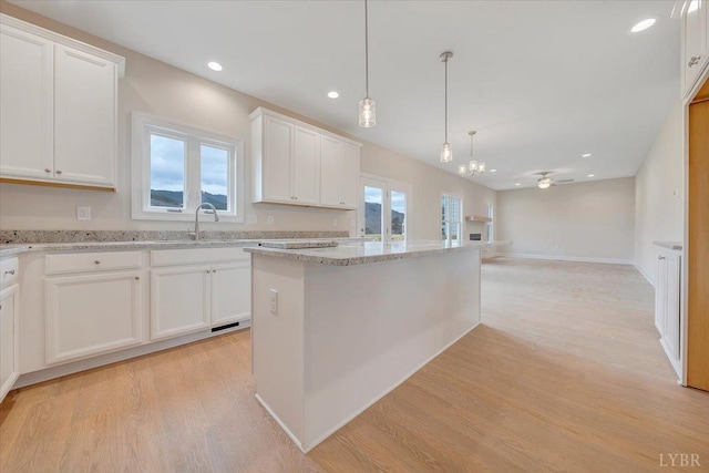 20 Elk Creel Rd, Forest, VA 24551 - kitchen with light wood-style flooring, ceiling fan, white cabinets, light stone countertops, and recessed lighting