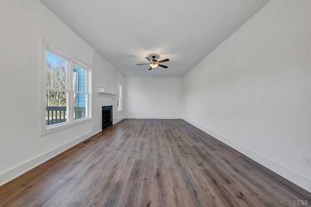 1197 Elk Creek Rd, Forest, VA 24551 - unfurnished living room featuring wood finished floors, a ceiling fan, and a fireplace