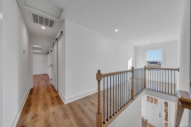 1197 Elk Creek Rd, Forest, VA 24551 - hallway featuring an upstairs landing, wood finished floors, a barn door, and recessed lighting