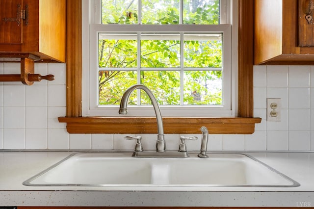 5822 Apache Ln, Lynchburg, VA 24503 - kitchen view of a sink, tasteful backsplash, light countertops, and brown cabinets