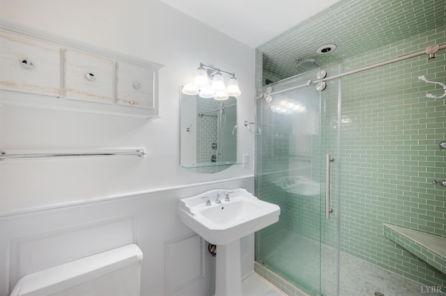 5822 Apache Ln, Lynchburg, VA 24503 - bathroom featuring a shower stall, toilet, and a wainscoted wall