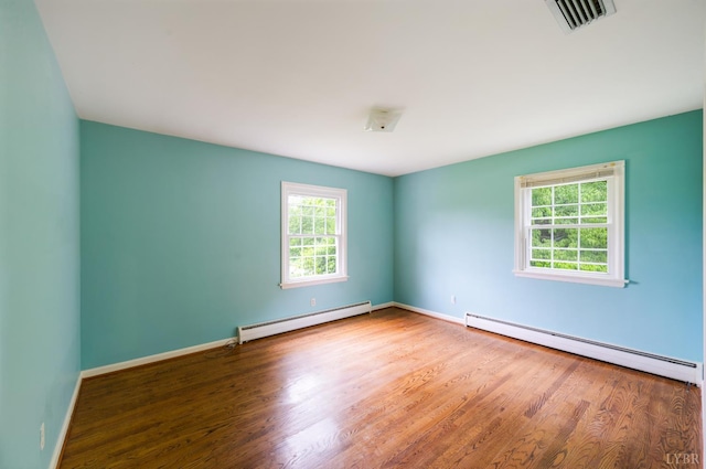 5822 Apache Ln, Lynchburg, VA 24503 - empty room with a baseboard heating unit, wood finished floors, and baseboards