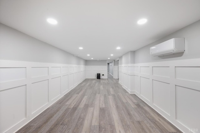 5822 Apache Ln, Lynchburg, VA 24503 - hallway with a decorative wall, a wall mounted AC, light wood-style floors, a wainscoted wall, and recessed lighting