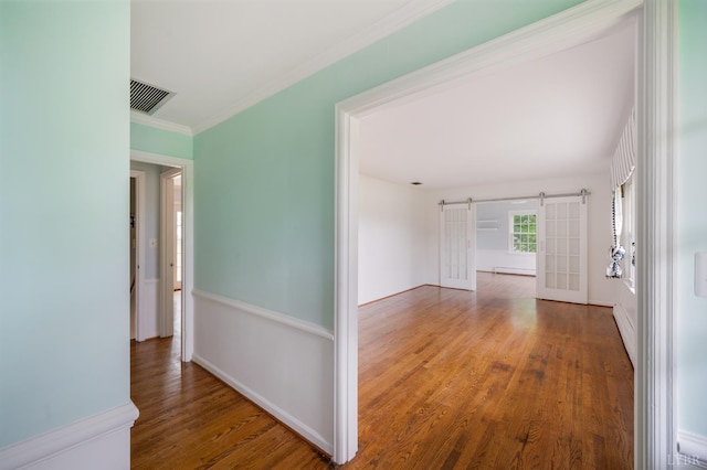 5822 Apache Ln, Lynchburg, VA 24503 - hall with a barn door, wood finished floors, a baseboard heating unit, crown molding, and baseboards