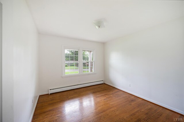 5822 Apache Ln, Lynchburg, VA 24503 - empty room featuring baseboard heating, wood finished floors, and baseboards