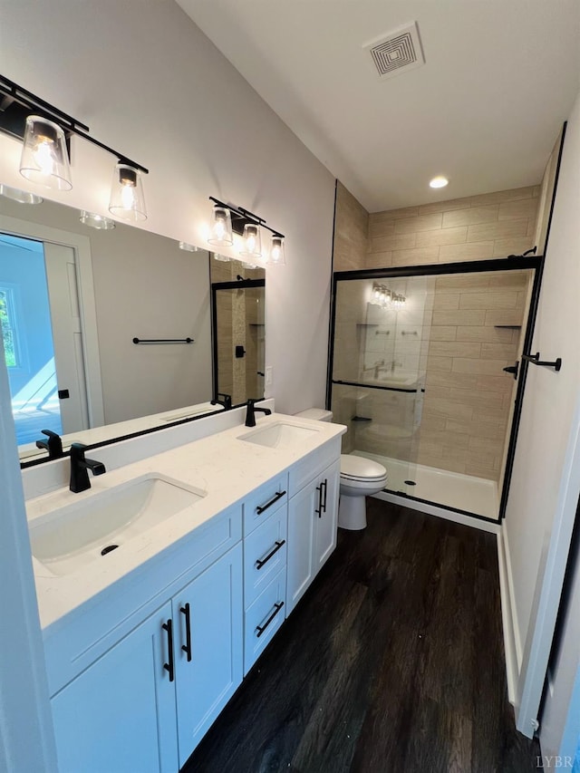 82 Lockridge Ln, Lynchburg, VA 24502 - full bath featuring wood finished floors, a stall shower, double vanity, toilet, and recessed lighting