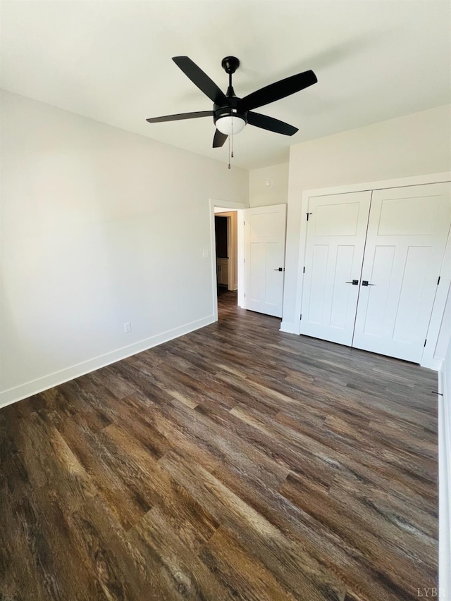 82 Lockridge Ln, Lynchburg, VA 24502 - unfurnished bedroom featuring dark wood finished floors, baseboards, a closet, and ceiling fan