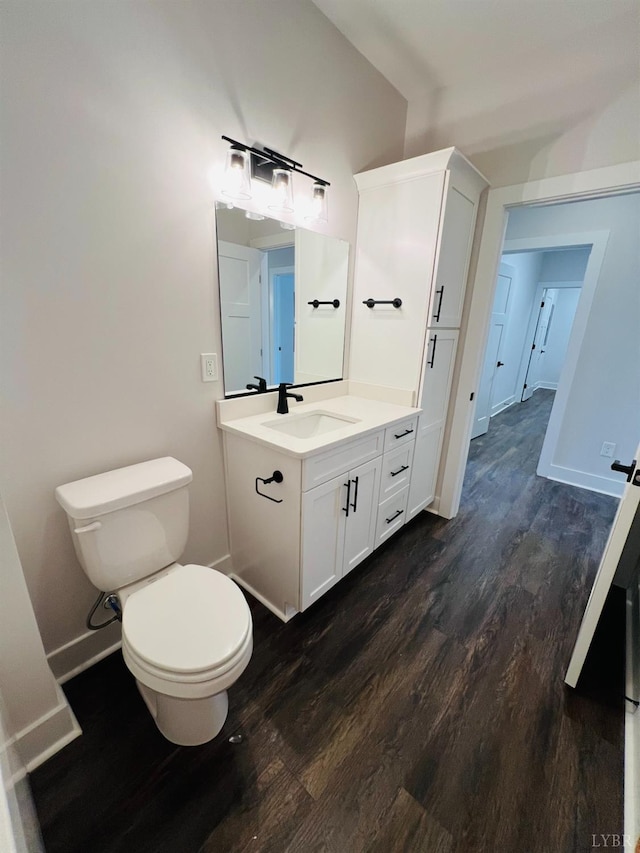 82 Lockridge Ln, Lynchburg, VA 24502 - bathroom with wood finished floors, toilet, vanity, and baseboards