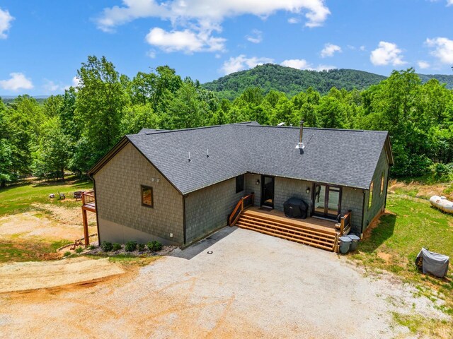 929 Poor House Farm Rd, Amherst, VA 24521 - view of front of home with a shingled roof, a deck with mountain view, a forest view, and driveway