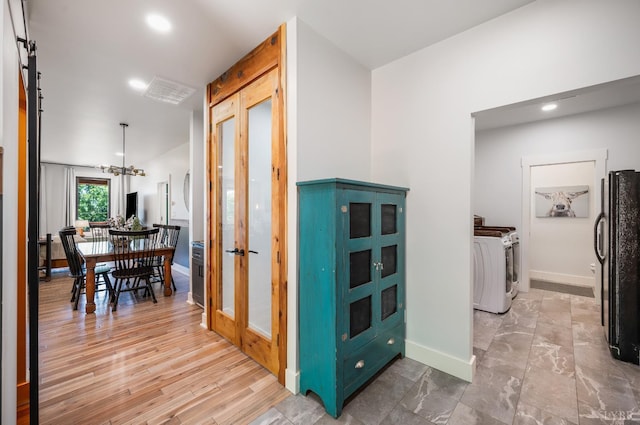 929 Poor House Farm Rd, Amherst, VA 24521 - hallway with french doors, a chandelier, recessed lighting, and separate washer and dryer