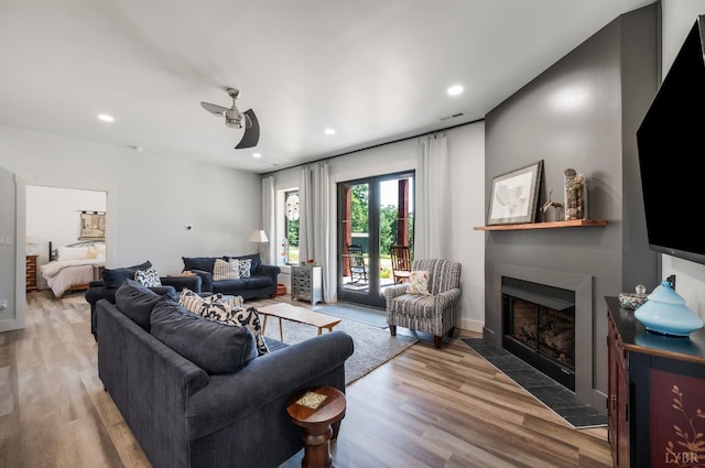 929 Poor House Farm Rd, Amherst, VA 24521 - living room with a fireplace with flush hearth, wood finished floors, recessed lighting, and ceiling fan