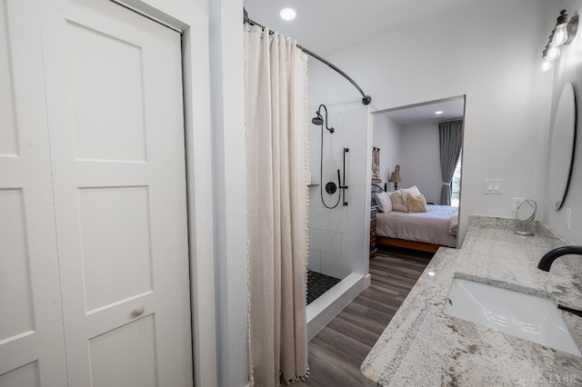 929 Poor House Farm Rd, Amherst, VA 24521 - ensuite bathroom featuring wood finished floors, curtained shower, double vanity, and recessed lighting