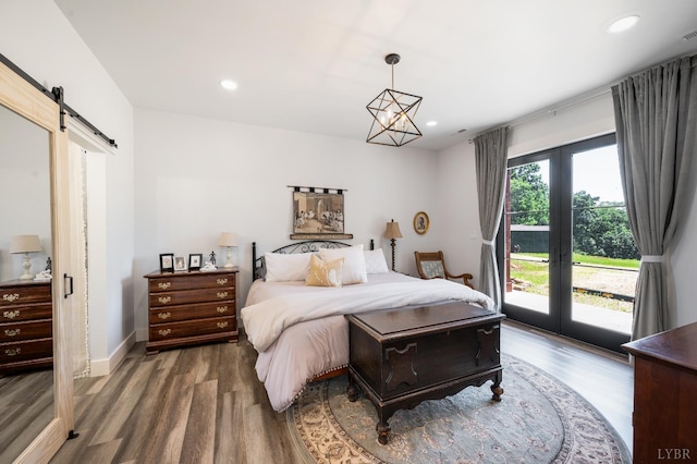 929 Poor House Farm Rd, Amherst, VA 24521 - bedroom with a barn door, access to exterior, wood finished floors, recessed lighting, and a chandelier