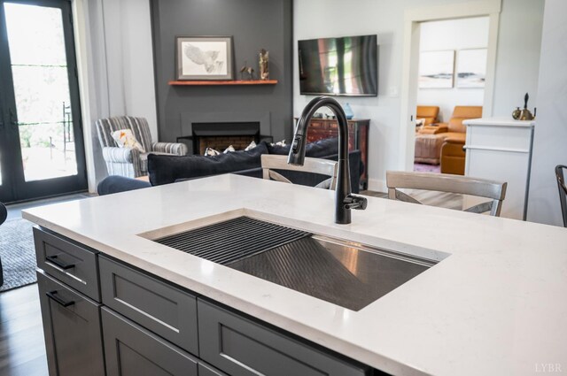 929 Poor House Farm Rd, Amherst, VA 24521 - kitchen with light countertops, a fireplace, open floor plan, and gray cabinetry