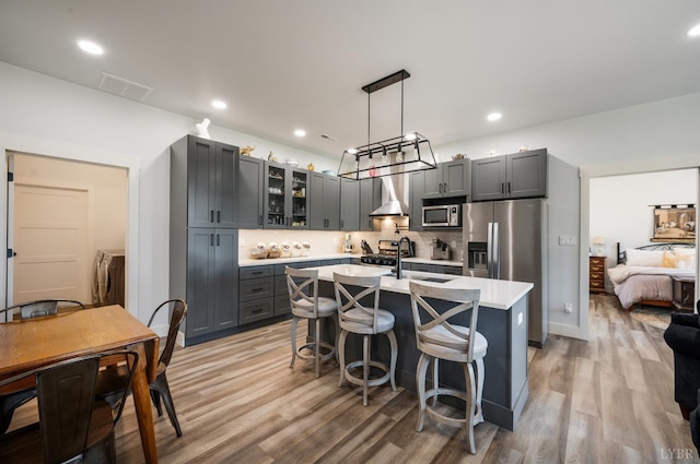 929 Poor House Farm Rd, Amherst, VA 24521 - kitchen with stainless steel appliances, light countertops, glass insert cabinets, backsplash, and gray cabinets