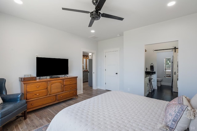 929 Poor House Farm Rd, Amherst, VA 24521 - bedroom featuring a barn door, wood finished floors, recessed lighting, ensuite bath, and ceiling fan
