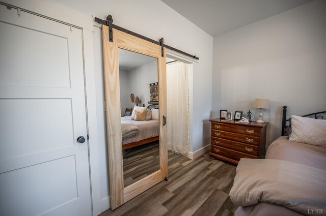 929 Poor House Farm Rd, Amherst, VA 24521 - bedroom with a barn door and wood finished floors