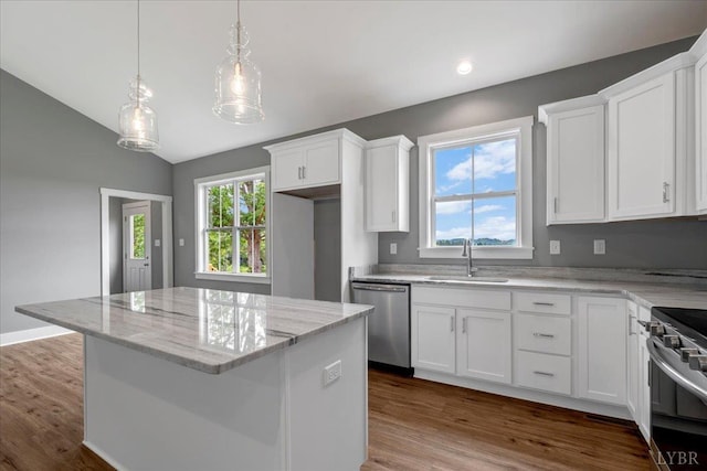 8638 Hat Creek Rd, Brookneal, VA 24528 - kitchen featuring stainless steel appliances, white cabinetry, light stone countertops, a center island, and lofted ceiling