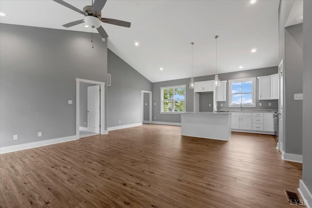 8638 Hat Creek Rd, Brookneal, VA 24528 - unfurnished living room with a ceiling fan, high vaulted ceiling, wood finished floors, and recessed lighting