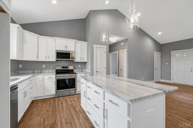 8638 Hat Creek Rd, Brookneal, VA 24528 - kitchen featuring stainless steel appliances, a kitchen island, high vaulted ceiling, white cabinets, and light stone countertops
